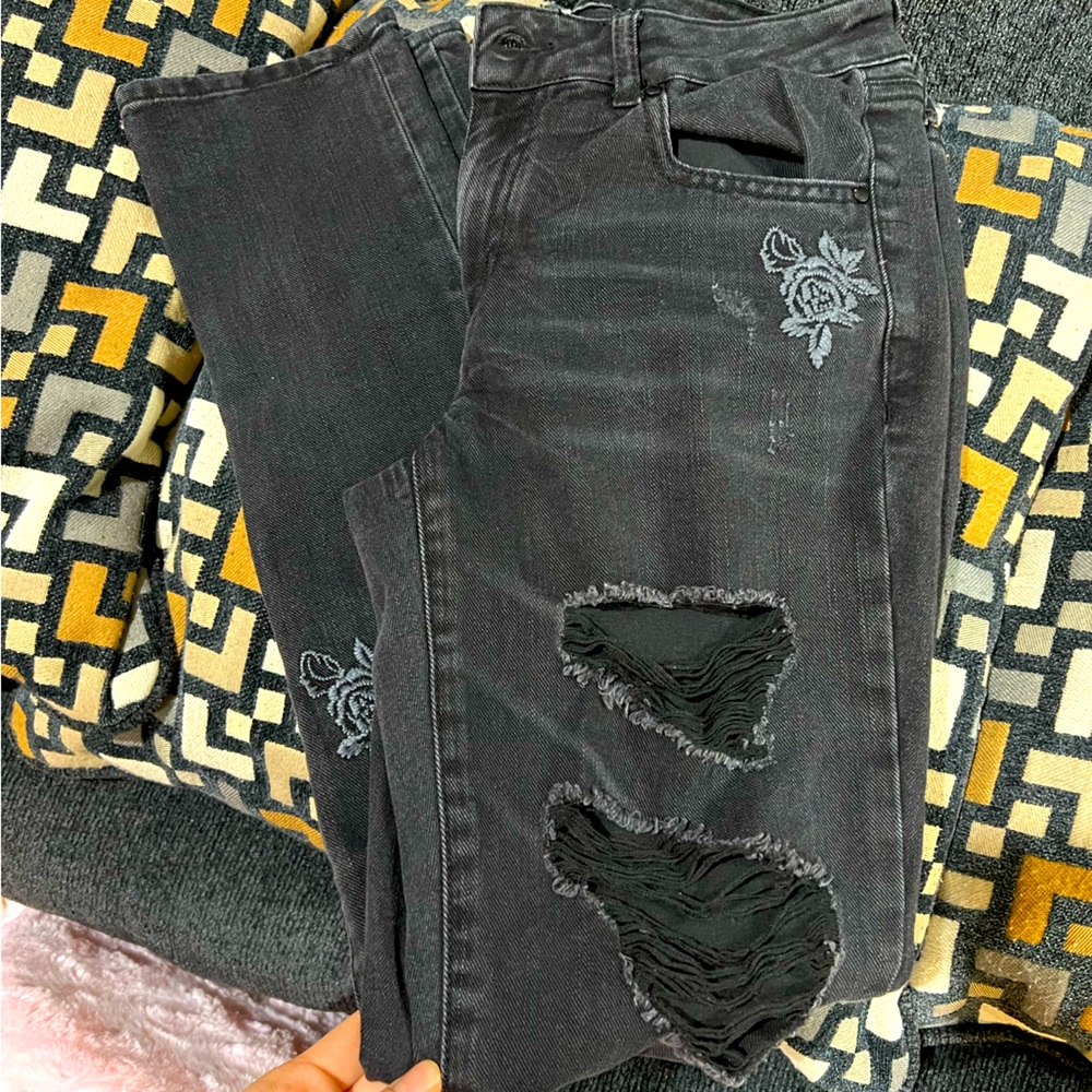 Black ripped jeans with floral design